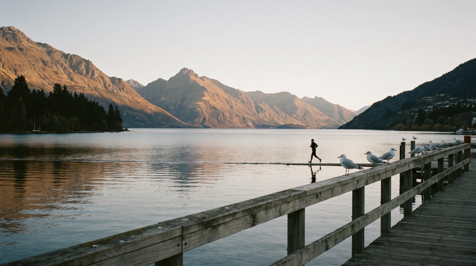 Morning light on the Queenstown waterfront at the start of one day in Queenstown, New Zealand