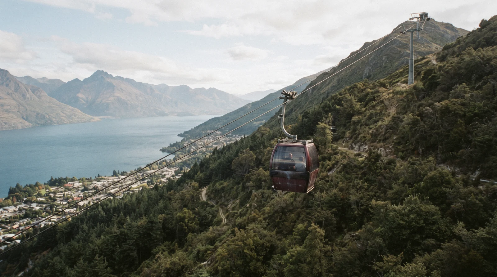 The Skyline gondola cabins climbing Bob's Peak above Lake Whakatipu on a visit to Queenstown, New Zealand