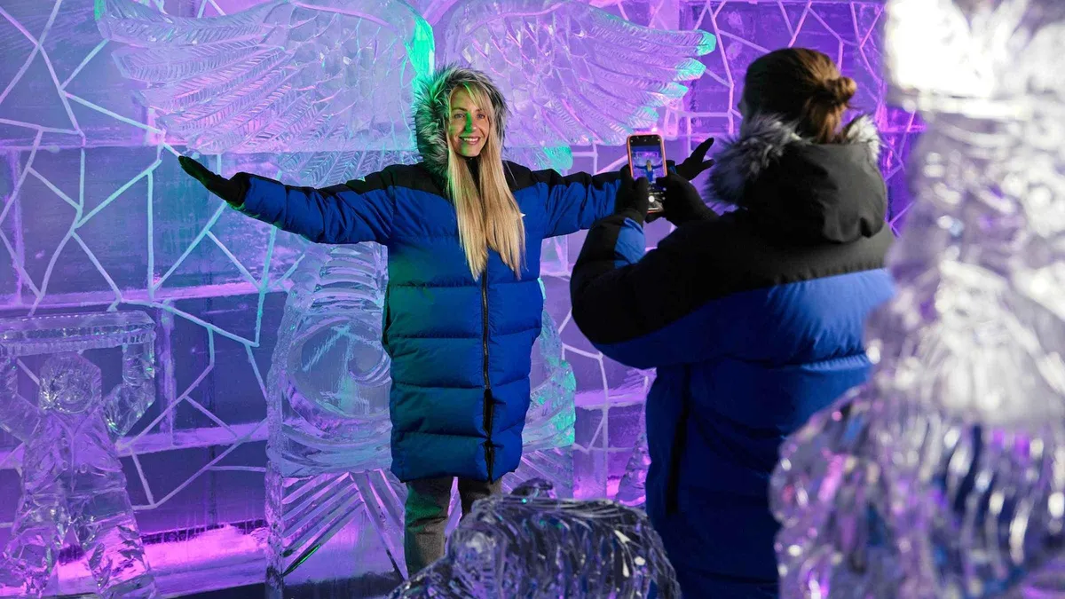 Hand-carved ice sculptures and an ice bar counter lit in blue — Queenstown on a rainy day, New Zealand